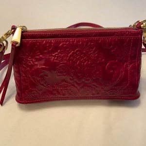 Embossed leather with 2 removable/adjustable straps.